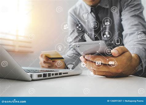 Hand Using Tablet Laptop And Holding Smartphone With Credit Card