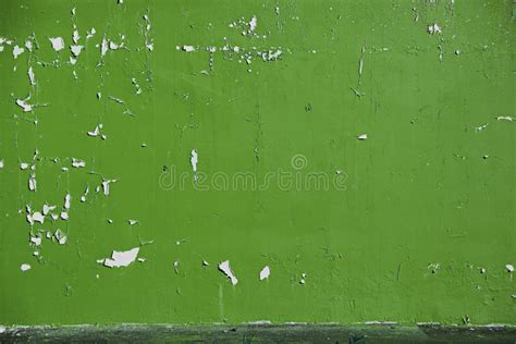 Background Peeled Olive Light Green Paint On The Wall Stock Photo