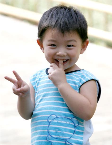 Young Chinese Child Doing V Sign In China People Are Used To Do
