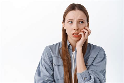 Free Photo Nervous Girl Biting Fingers And Looking Aside With Worried