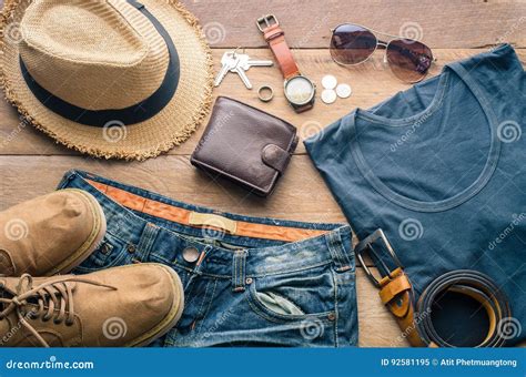 Accessories And Apparel For Travel On A Wooden Floor Stock Image