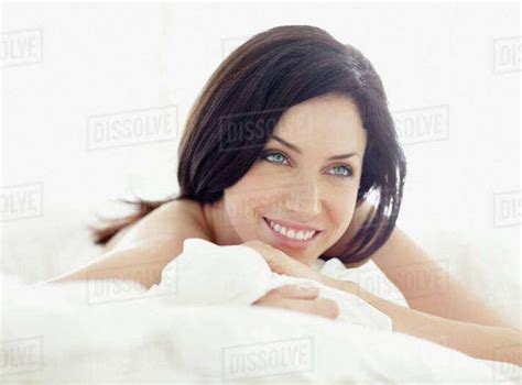 Sexy Woman Lying On Bed Stock Photo Dissolve