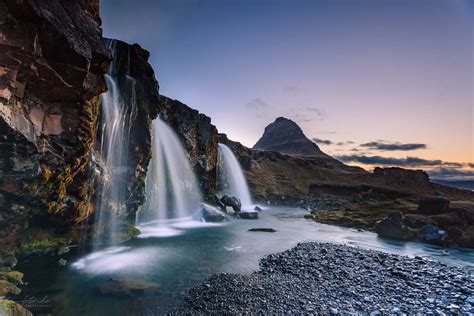 Kirkjufellsfoss Waterfall And Kirkjufell Mountain In Iceland Iceland