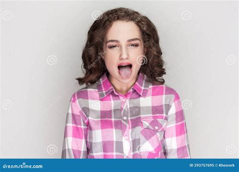 Disgusted Pretty Woman Sticking Out Tongue Expressing Her Dislike Or Disregard Towards