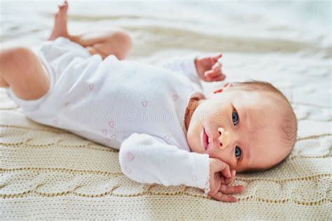 Baby Girl Lying On Bed In Nursery Stock Photo Image Of Little