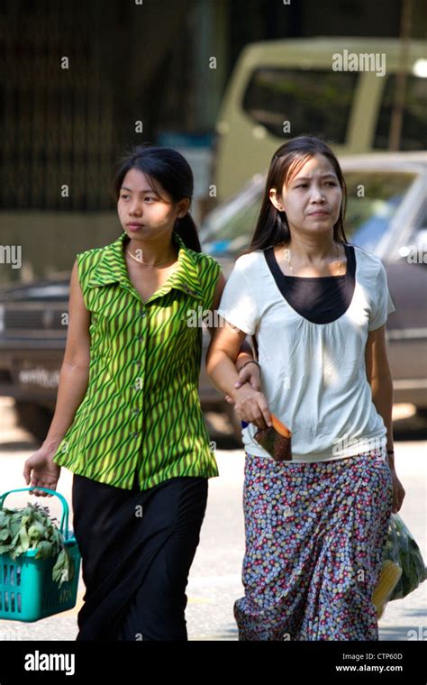 Burmese Women Walk Arm In Arm On The Street In Rangoon Yangon Burma