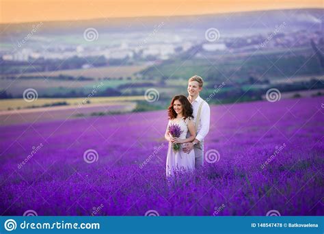 Romantic Couple In An Endless Lavender Field At Sunset Blond Man And