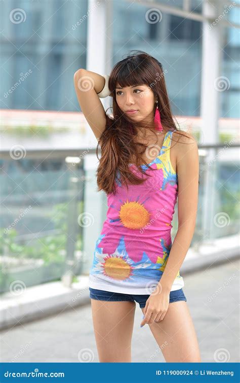 Beautiful Asian Girl Showing Youthful Vigor On The Pedestrian Bridge Stock Photo Image Of