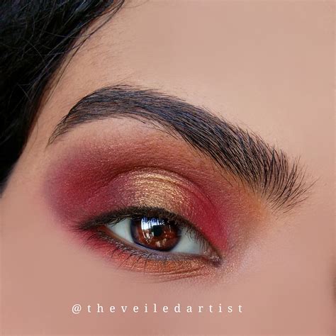 Red And Gold Halo Smokey Eyes With Dramatic Arabic Winged Liner