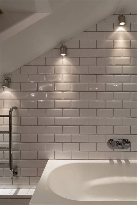 Must incorporate a skylight above bathtub! Lighting design by John Cullen Lighting | Sloped ceiling ...