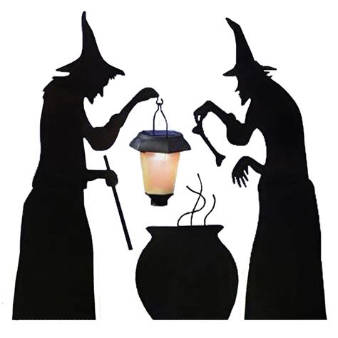 Two Silhouettes Of Witches With A Lantern And Caulder