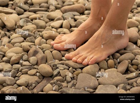 Woman Feet Walking On Sea Pebbles Natural Foot Massage Beauty And Body Care Healthy Lifestyle