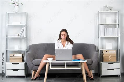 seductive secretary with sexy legs sit on sofa in office sexy business woman or secretary with