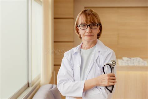 Doctor Female Standing Confident Smiling In Hospital For Healthcare