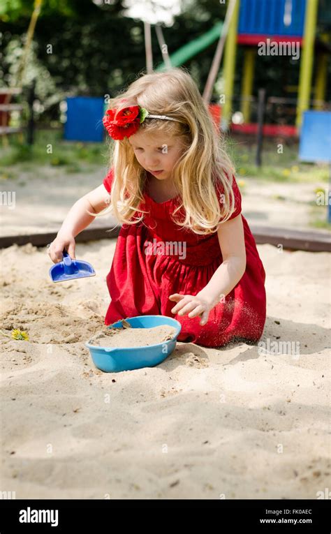 Beautiful Blond Girl Playing In Sandpit Stock Photo Alamy