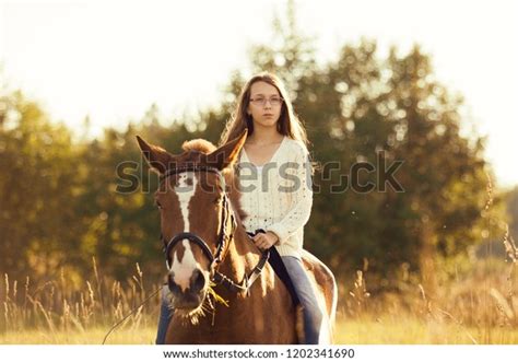 Young Girl Sitting Astride Sorrel Horse Stock Photo 1202341690