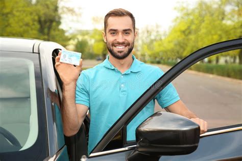 Young Man Holding Driving License Stock Photo Image Of Automotive