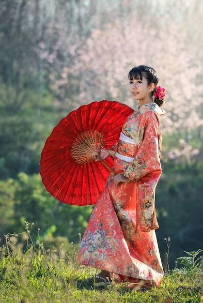 Premium Photo Attractive Asian Woman Wearing Traditional Japanese Kimono With Red Umbrella
