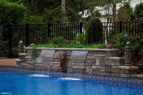 Raised Stone Wall With Sheer Descent Water Feature At New Vinyl Liner