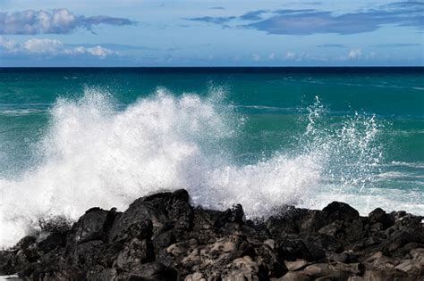 Wave Breaking On Black Lava Rock In Hawaiiwhite Spray In The Air Ocean