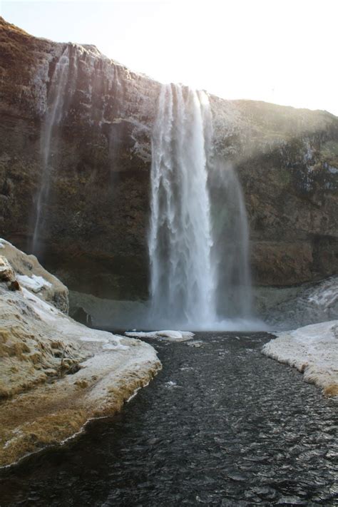 Seljalandsfoss Waterfall And The Icelandic Hermit Cave Of Gljufrabui