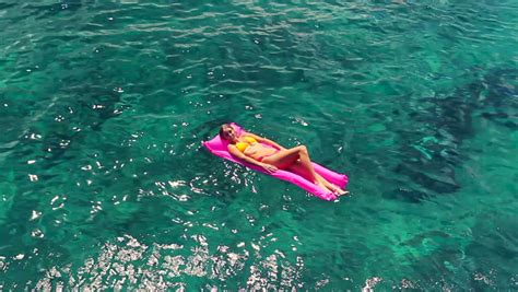 Woman Floating On Pool Raft In The Sea Stock Footage Video 1308010