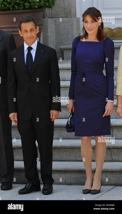 French President Nicolas Sarkozy And His Wife Carla Bruni Sarkozy Pose