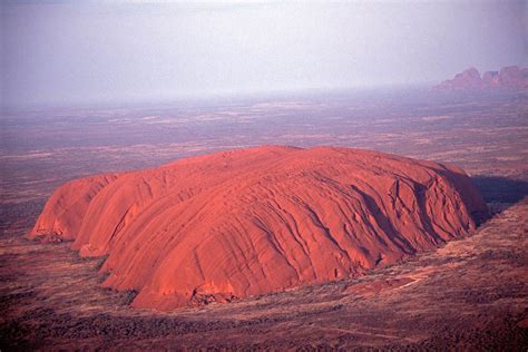 Uluru/ayers rock, giant monolith, one of the tors (isolated masses of weathered rock) in southwestern northern territory, central australia. Uluru (Ayers Rock) & Kata Tjuta (The Olgas)