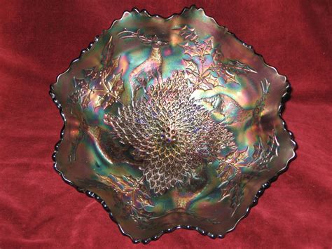 A Decorative Glass Bowl Sitting On Top Of A Red Cloth