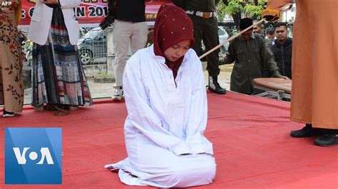 woman in indonesia flogged for pre marital sex in aceh banned under sharia law youtube