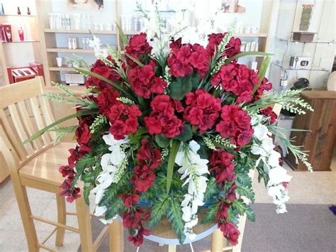 If you're honoring the memory of a specific friend or family member, you might choose a floral garden wreath flowers like red roses are commonly chosen by families to place on graves in cemeteries and to decorate headstones. Red & Ivory memorial saddle, monument, grave, tombstone ...