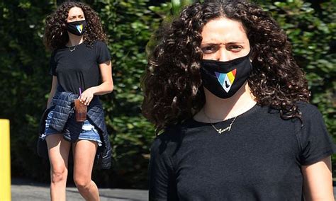 Emmy Rossum Puts On Leggy Display In Daisy Dukes As She Makes Coffee