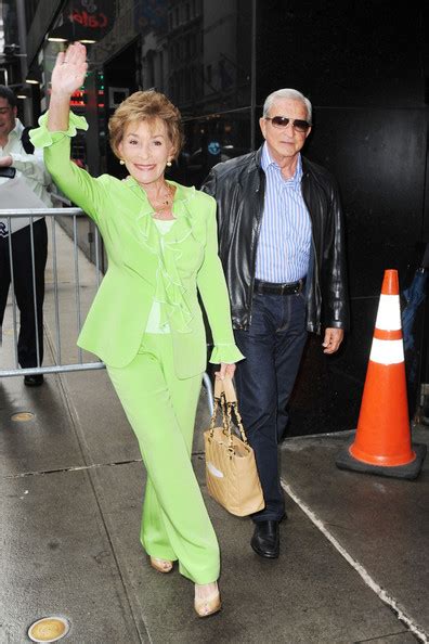 Judge Judy Arrives At Good Morning America In New York City Wearing A Bright Lime Green Pants Suit