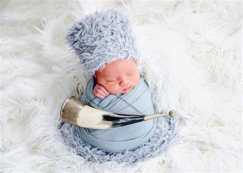 Premium Photo Portrait Of Newborn Baby Boy Swaddled In Light Blue