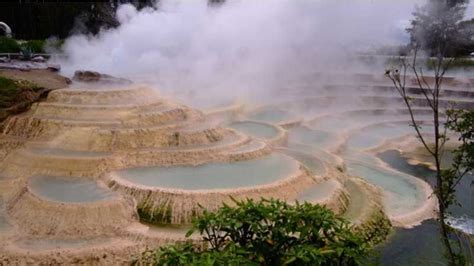 The Hot Springs Are Surrounded By Trees And Water