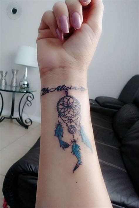 Dream catcher designs look great tattooed on the thigh. Dream Catcher Tattoo for Women | Wrist tattoos, Wrist ...