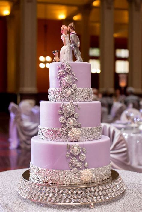 a wedding cake with two people on top