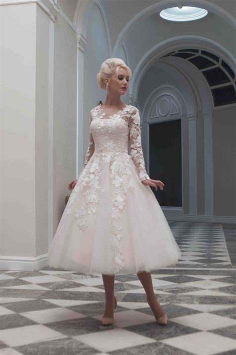 A Short Ballerina Length Blush Tulle And Lace Wedding Dress With Long