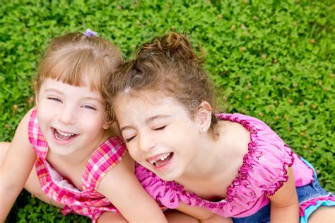Children Girls Laughing Sit On Green Grass Stock Image Image Of