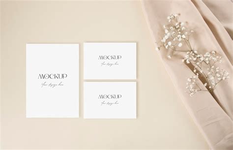 Premium PSD Mockup Wedding Invitation Card With White Gypsophila And Nude Fabric On The Beige