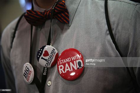 An Attendee Wears Pins In Support Of Us Sen Rand Paul During The
