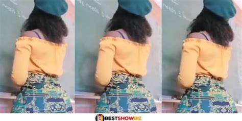video female teacher storms classroom with her gargantuan backside writing on board