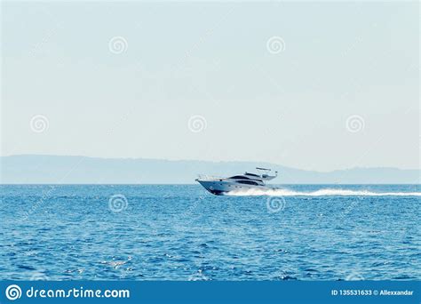 Luxury Motor Boat Cruising In Blue Sea Summer Vacation Stock Image