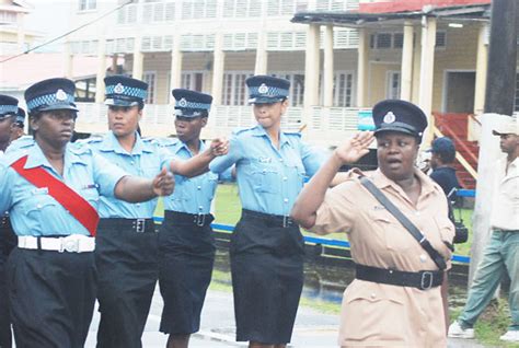 Female Police Officers Give The Salute Outside The Guyana Police Force