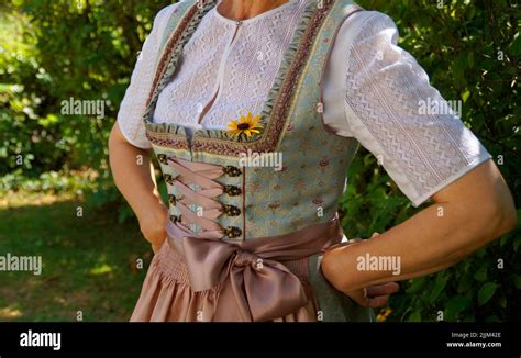 A Woman In A Beautiful Traditional Bavarian Dirndl Dress At The