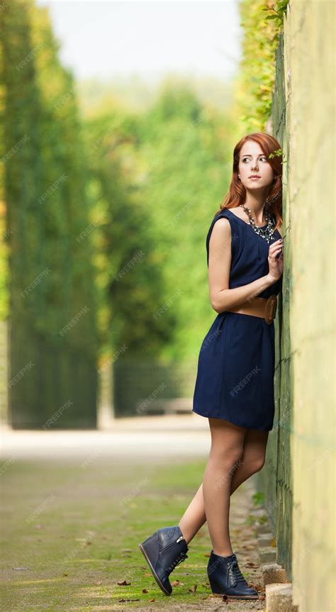 Premium Photo Beautiful Redhead Women In Versailles Gardens