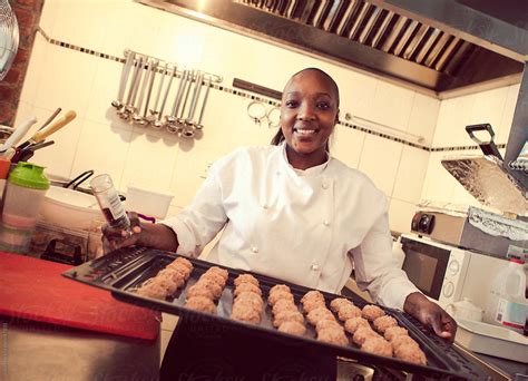 Female African Cook Baking In A Restaurant By Stocksy Contributor