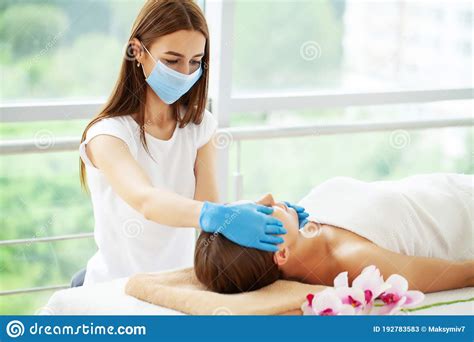 Young Beautiful Girl Having Face Massage Relaxing In Spa Salon Stock Image Image Of