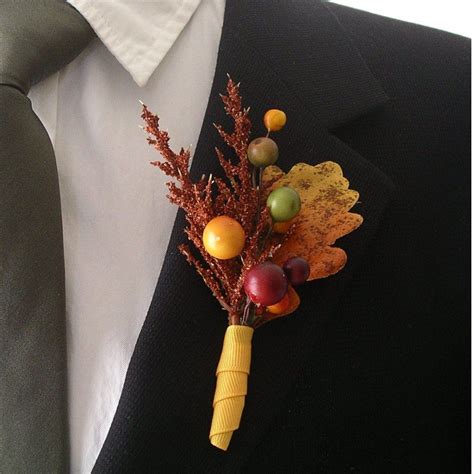 A Fall Berry And Leaf Wedding Boutonniere Accented With Rust Astible