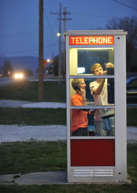 Who are the people in the picture? The Guzzler: Arkansas phone booth is first of its kind to ...